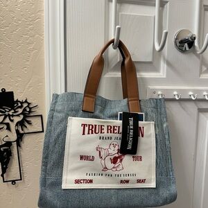 True Religion Blue Denim Tote with Brown Handles and Red Logo Patch